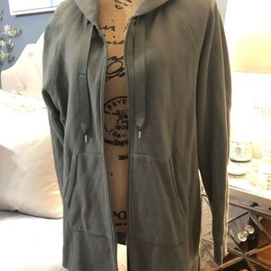 Army green zip-up hoodie.